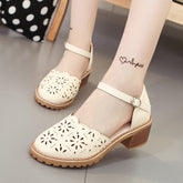 Cut out Roman sandals with thick heels
