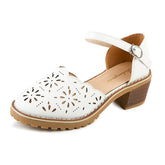 Cut out Roman sandals with thick heels