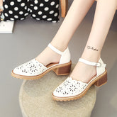 Cut out Roman sandals with thick heels