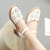 Cut out Roman sandals with thick heels